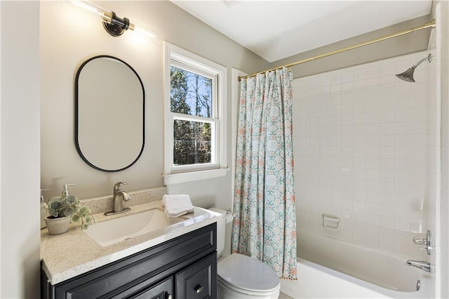 full bathroom with vanity, shower / bath combo with shower curtain, and toilet