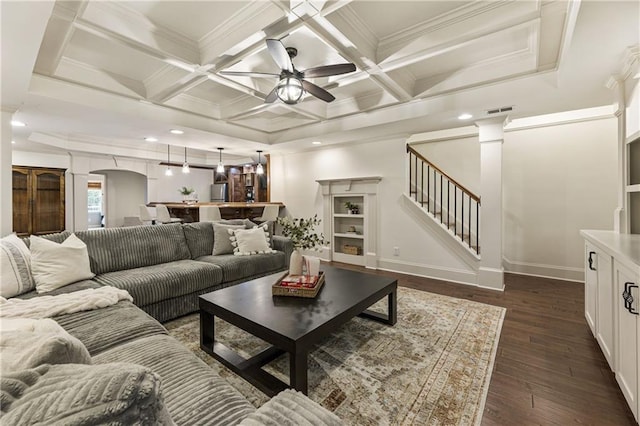 living room featuring stairs, coffered ceiling, dark wood-style floors, and visible vents