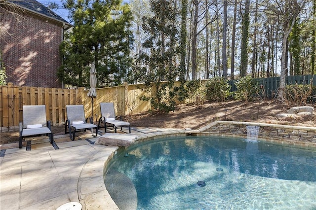 view of pool with a fenced in pool, a patio area, and a fenced backyard