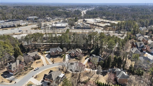 aerial view featuring a wooded view