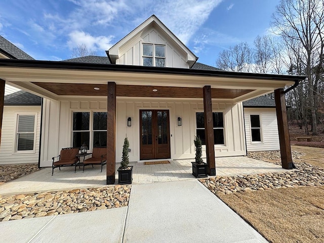526 Spring Place Rd NE, White, GA 30184 - property entrance with board and batten siding, a porch, and a shingled roof