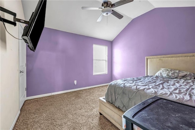 bedroom with ceiling fan, carpet, baseboards, and vaulted ceiling