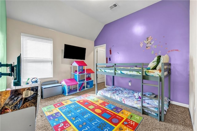 bedroom with carpet, visible vents, vaulted ceiling, and baseboards