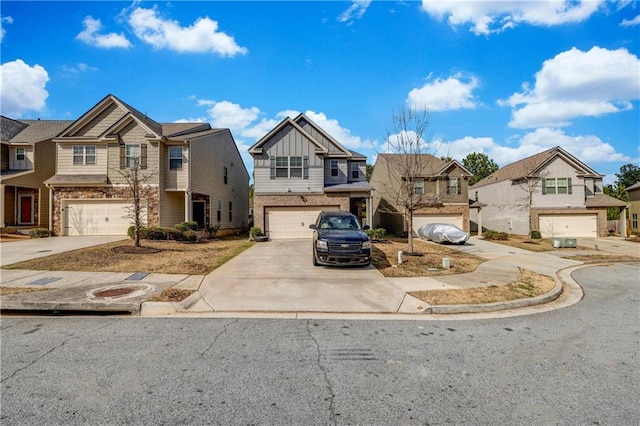 view of front of property with an attached garage, a residential view, board and batten siding, and concrete driveway