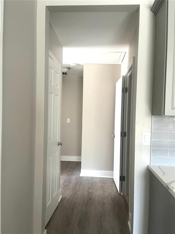 hallway featuring dark hardwood / wood-style flooring