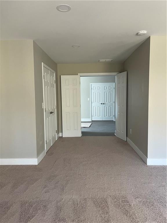 hallway featuring carpet floors