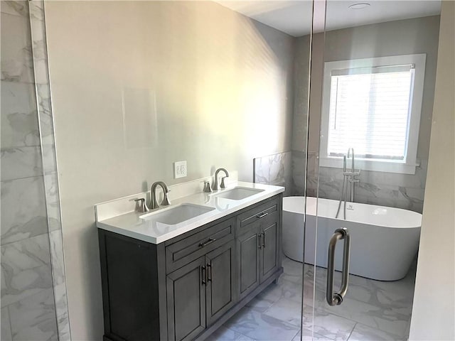 bathroom featuring vanity, a bathtub, and tile walls