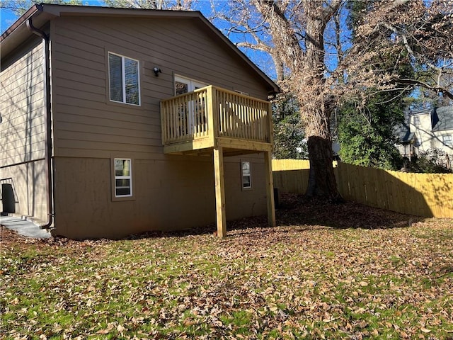 view of side of home featuring a balcony