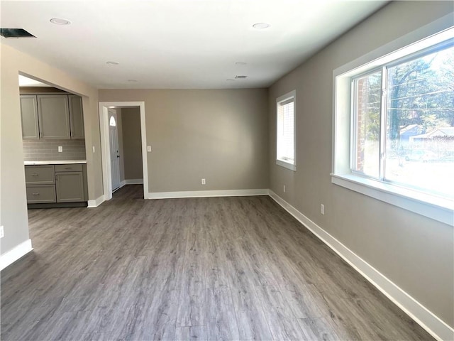 unfurnished living room with hardwood / wood-style flooring