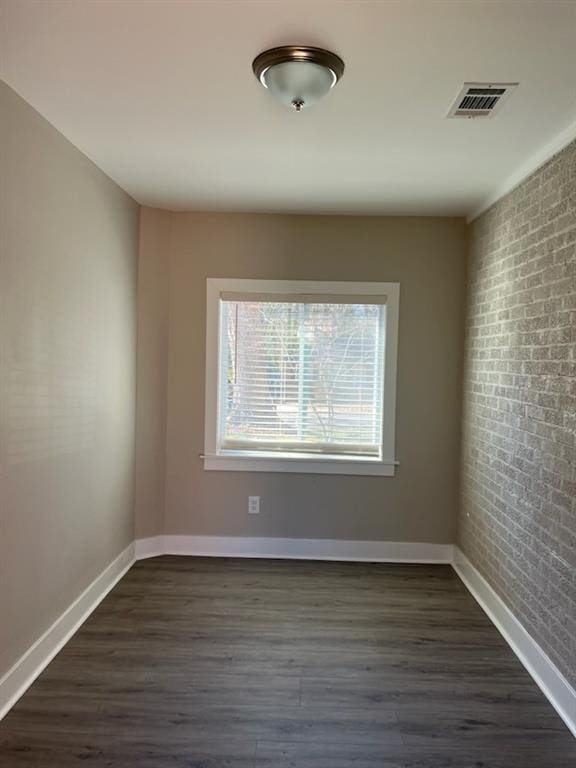 unfurnished room with dark hardwood / wood-style floors