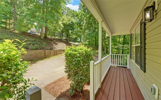 wooden terrace featuring covered porch