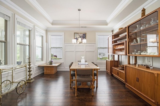 11375 Crestview Ter, Johns Creek, GA 30024 - dining space with a chandelier, dark wood-type flooring, a tray ceiling, a decorative wall, and ornamental molding