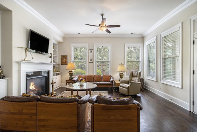 11375 Crestview Ter, Johns Creek, GA 30024 - living room with ceiling fan, dark wood-style floors, ornamental molding, baseboards, and a warm lit fireplace