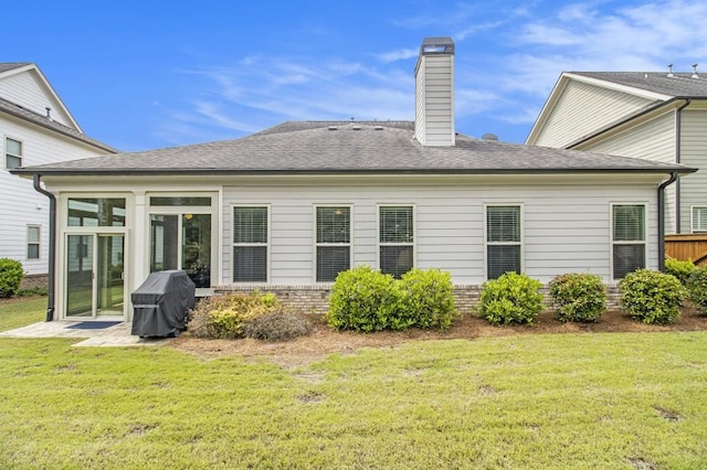11375 Crestview Ter, Johns Creek, GA 30024 - rear view of house with a yard, a chimney, roof with shingles, and a sunroom