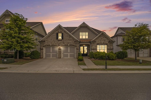 11375 Crestview Ter, Johns Creek, GA 30024 - craftsman-style home featuring concrete driveway, a garage, brick siding, and french doors
