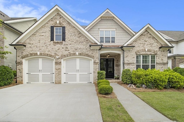 11375 Crestview Ter, Johns Creek, GA 30024 - view of front facade with concrete driveway, brick siding, a garage, and a front yard