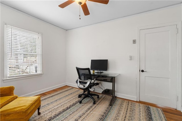 home office featuring wood-type flooring and ceiling fan