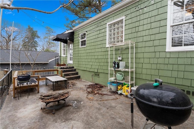 view of patio with a fire pit