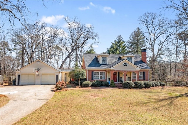 cape cod-style house featuring a garage, concrete driveway, brick siding, and a front lawn