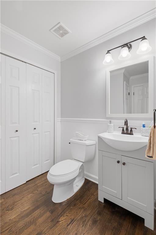 1045 River Pt, Suwanee, GA 30024 - bathroom featuring vanity, wood finished floors, ornamental molding, and a closet