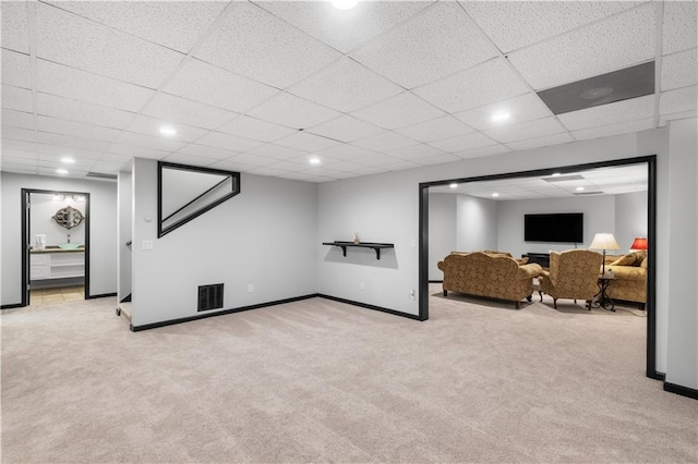 1045 River Pt, Suwanee, GA 30024 - finished below grade area featuring light colored carpet, a paneled ceiling, and recessed lighting