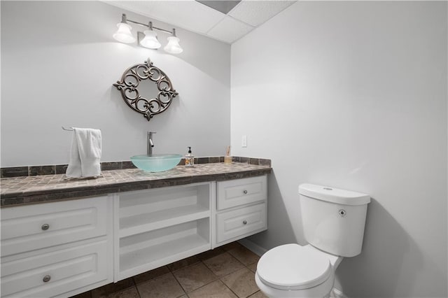 1045 River Pt, Suwanee, GA 30024 - half bath with vanity, tile patterned flooring, and a drop ceiling
