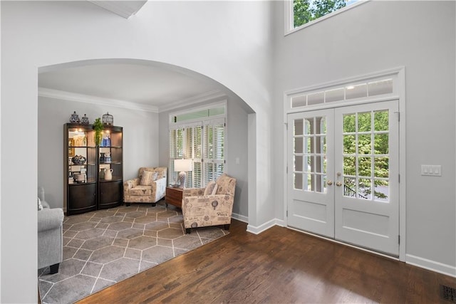 1045 River Pt, Suwanee, GA 30024 - foyer with arched walkways, french doors, crown molding, wood finished floors, and plenty of natural light