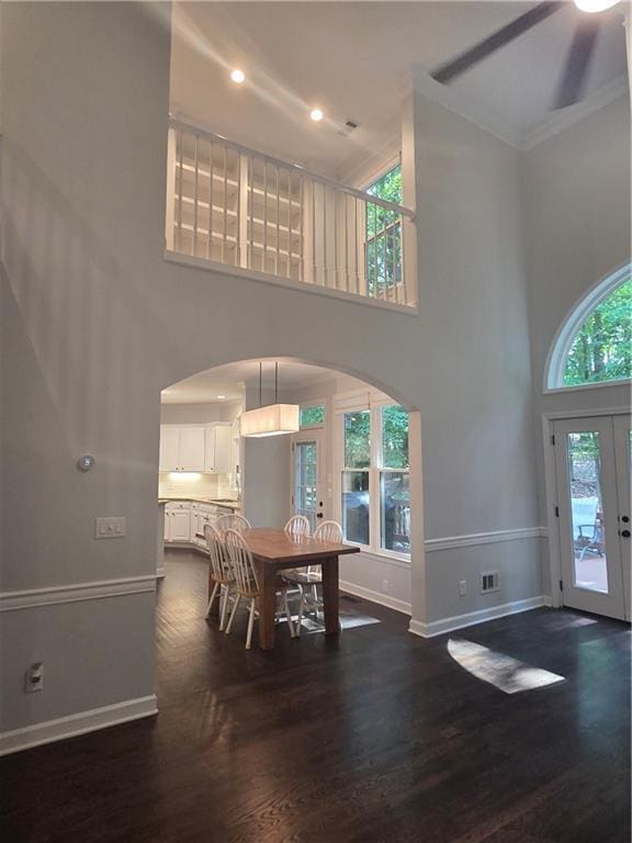 1045 River Pt, Suwanee, GA 30024 - entryway with a high ceiling, arched walkways, dark wood-type flooring, french doors, and ceiling fan