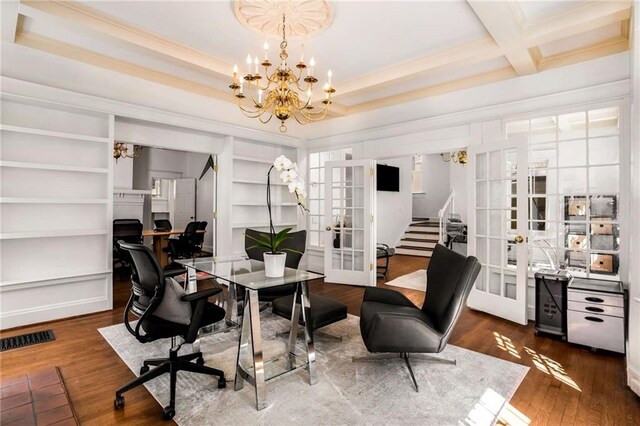 office space featuring french doors, a notable chandelier, crown molding, and dark wood-type flooring