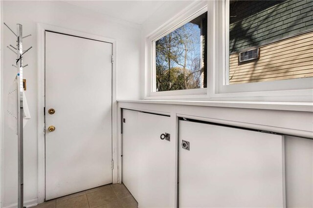 doorway featuring light tile patterned floors