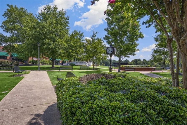 view of home's community featuring a lawn