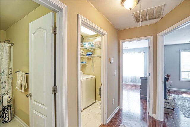 3068 Cedar Glade Ln, Buford, GA 30519 - hallway featuring independent washer and dryer and light wood-type flooring