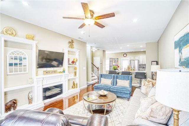 3068 Cedar Glade Ln, Buford, GA 30519 - living room with ceiling fan and light wood-type flooring