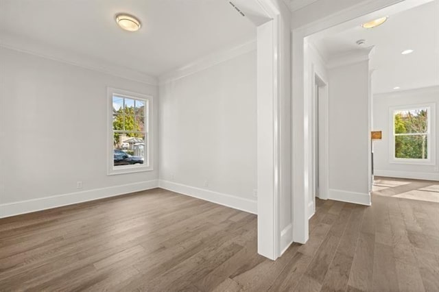 1005 Coleman Place Dr, Roswell, GA 30075 - empty room featuring crown molding, healthy amount of natural light, wood finished floors, and recessed lighting