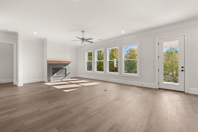 1005 Coleman Place Dr, Roswell, GA 30075 - unfurnished living room with a fireplace, ceiling fan, wood finished floors, crown molding, and recessed lighting