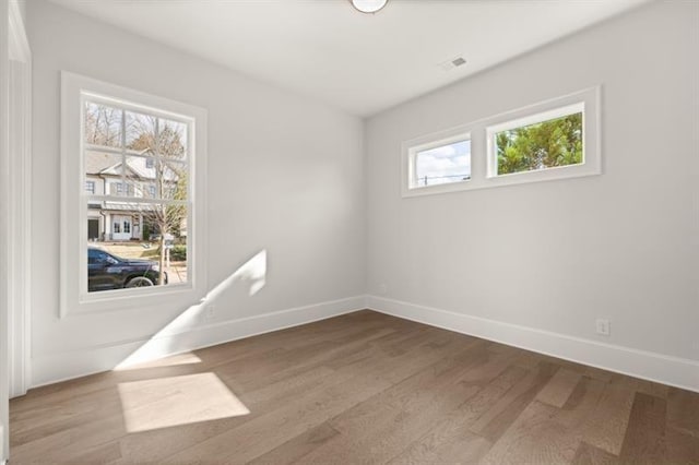 1005 Coleman Place Dr, Roswell, GA 30075 - spare room with baseboards and wood finished floors