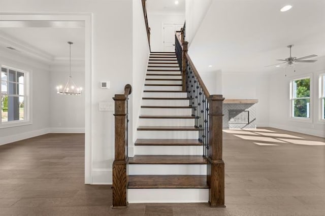 1005 Coleman Place Dr, Roswell, GA 30075 - staircase with crown molding, wood finished floors, recessed lighting, a ceiling fan, and a chandelier