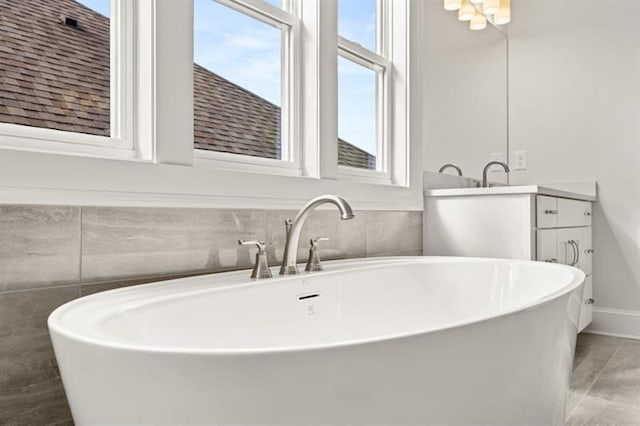 1005 Coleman Place Dr, Roswell, GA 30075 - bathroom featuring a soaking tub, vanity, and tile patterned floors