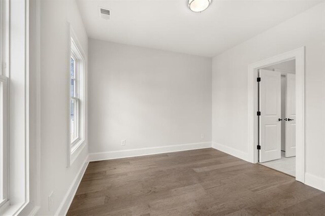 1005 Coleman Place Dr, Roswell, GA 30075 - unfurnished room with wood finished floors and plenty of natural light
