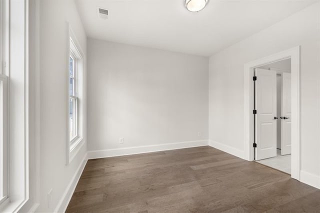 1005 Coleman Place Dr, Roswell, GA 30075 - empty room with wood finished floors and healthy amount of natural light