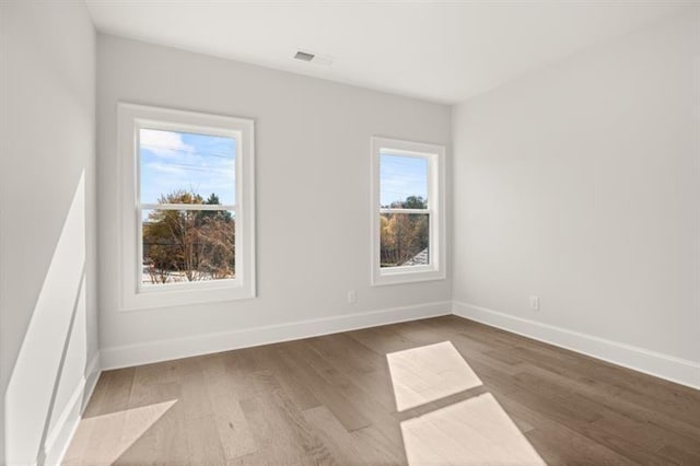 1005 Coleman Place Dr, Roswell, GA 30075 - unfurnished room with wood finished floors and baseboards