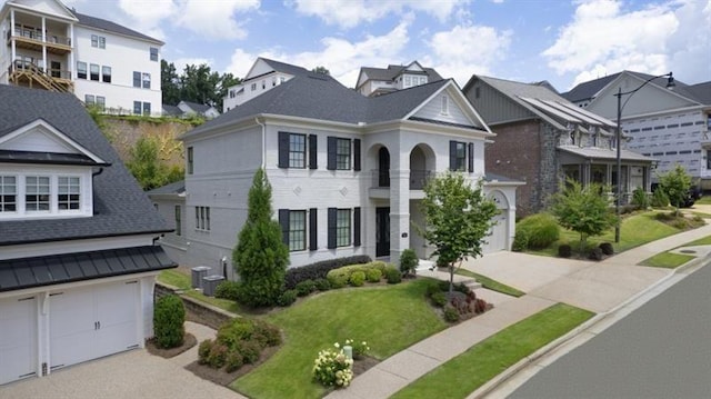 1005 Coleman Place Dr, Roswell, GA 30075 - view of front of property featuring a garage, concrete driveway, a residential view, and a front lawn