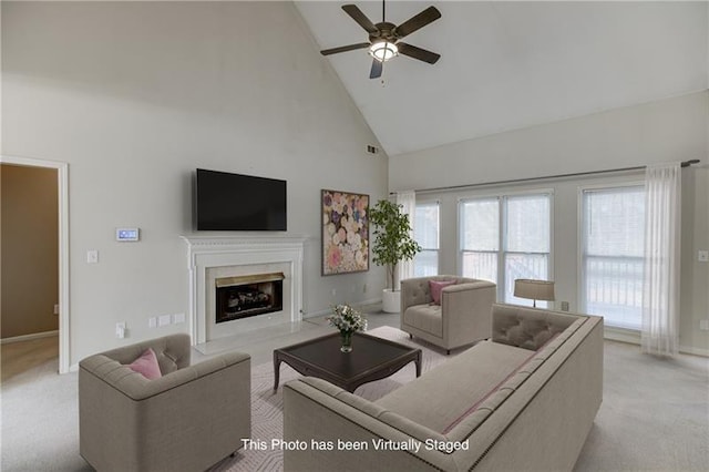 carpeted living room featuring high vaulted ceiling, ceiling fan, and a fireplace