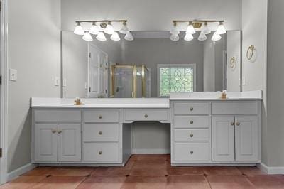 bathroom featuring tile patterned floors, vanity, and an enclosed shower