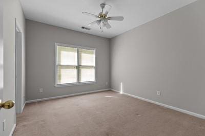 carpeted empty room with ceiling fan