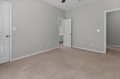 unfurnished bedroom with light colored carpet and ceiling fan