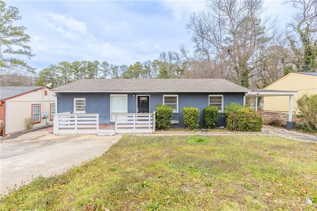 ranch-style home with a porch, a front lawn, and stucco siding