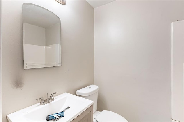 bathroom with toilet and vanity