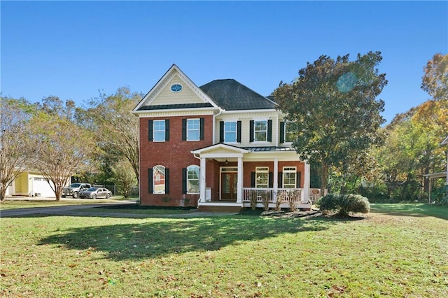 view of front facade with a porch and a front lawn