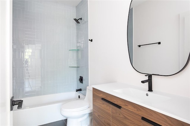 full bathroom with vanity, toilet, and tiled shower / bath